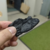Carbonized sake lees in an electric furnace
