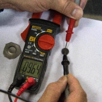 Measurement of electrical conductivity of the sintered graphite derived from sake lees
