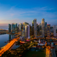 Singapore city and sunrise sky in harbour side view of hotel windows