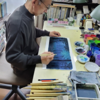Anime artist Kazuo Oga works on a background scene for the famed bunraku play "The Love Suicides at Sonezaki." | TOMOKO OGAWA